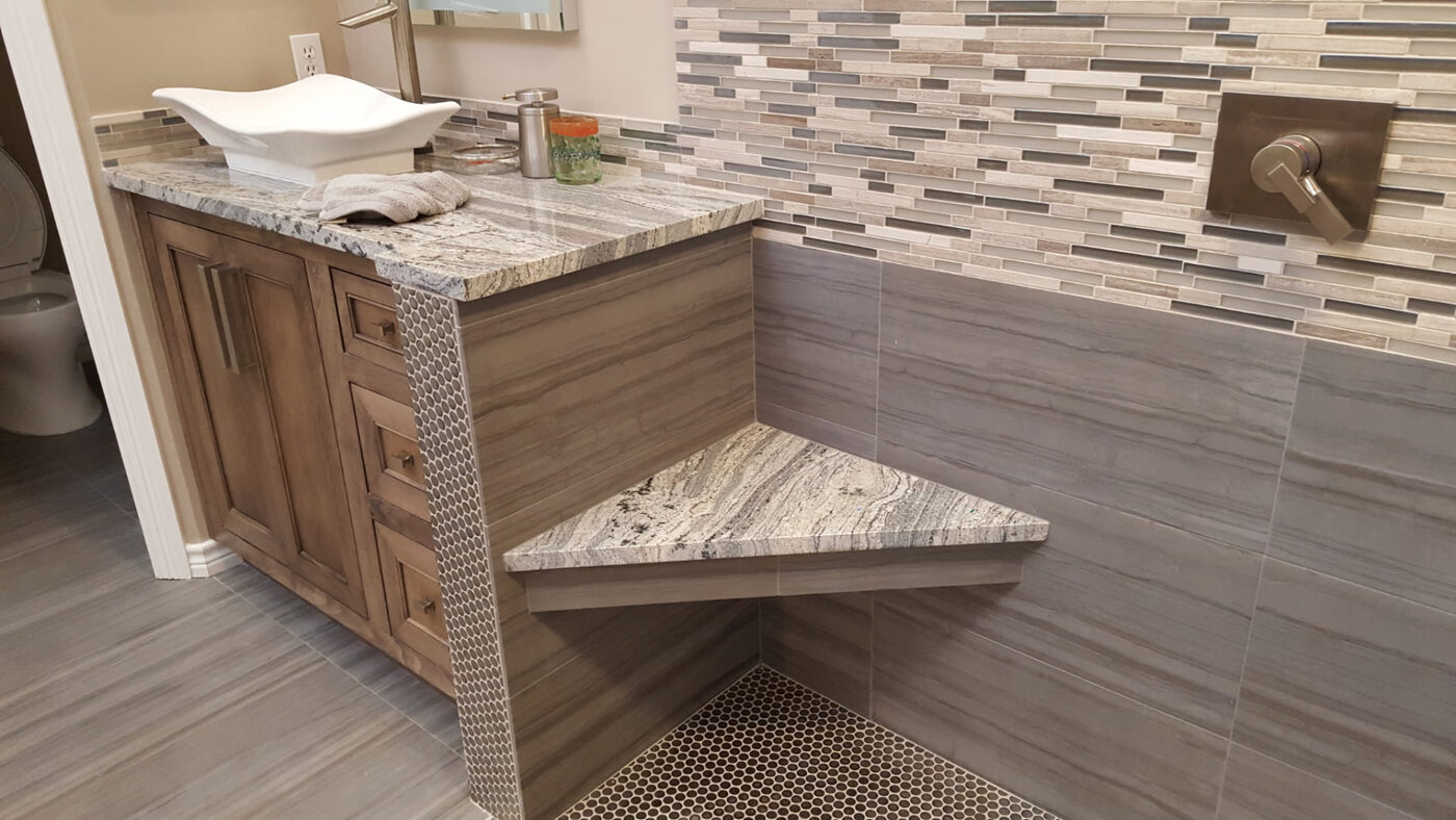 Vanity Backsplash & Corner Shower Seat by Masterpiece Tile and Grout in the DFW area