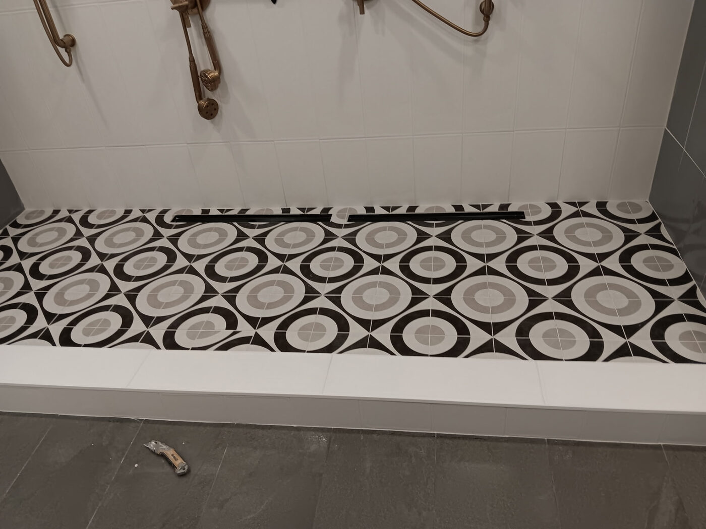 Patterned Shower Floor Tile by Masterpiece Tile and Grout in the DFW area